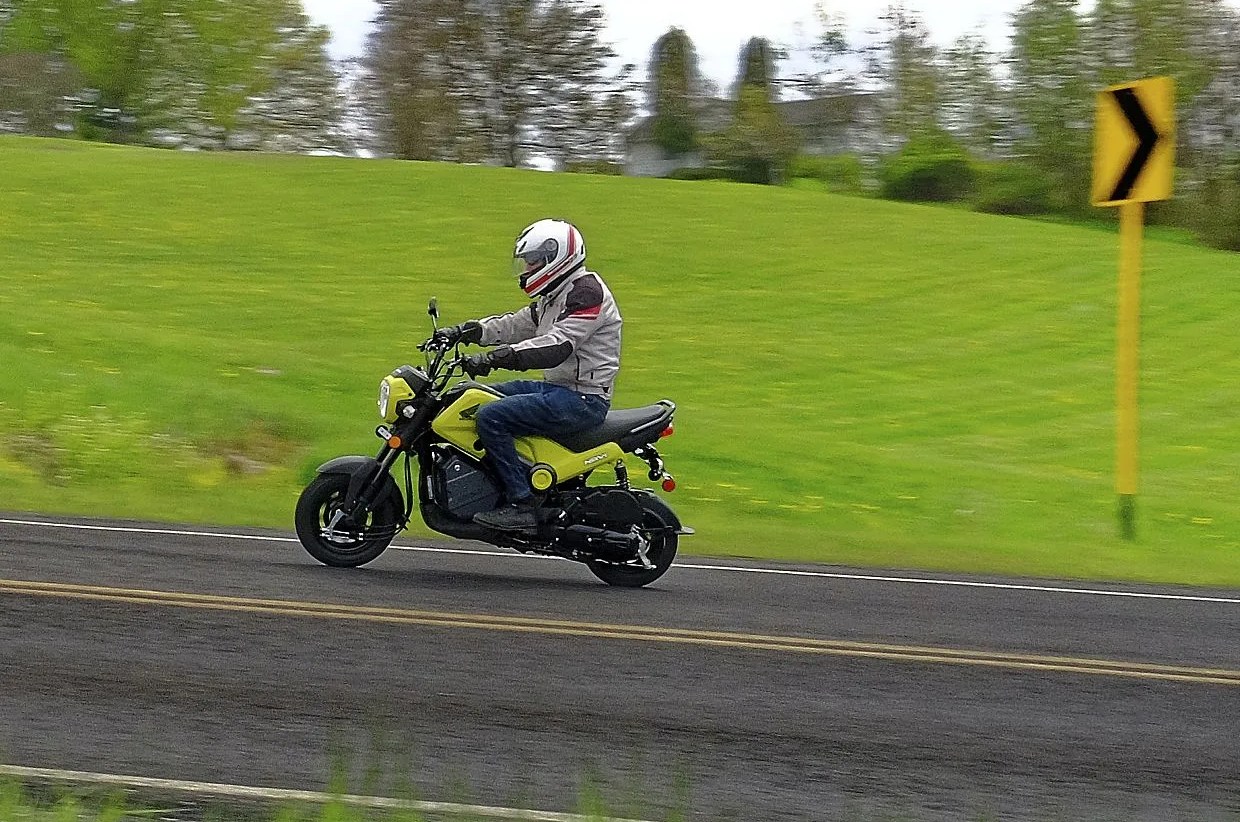 man riding the 2022 honda navi