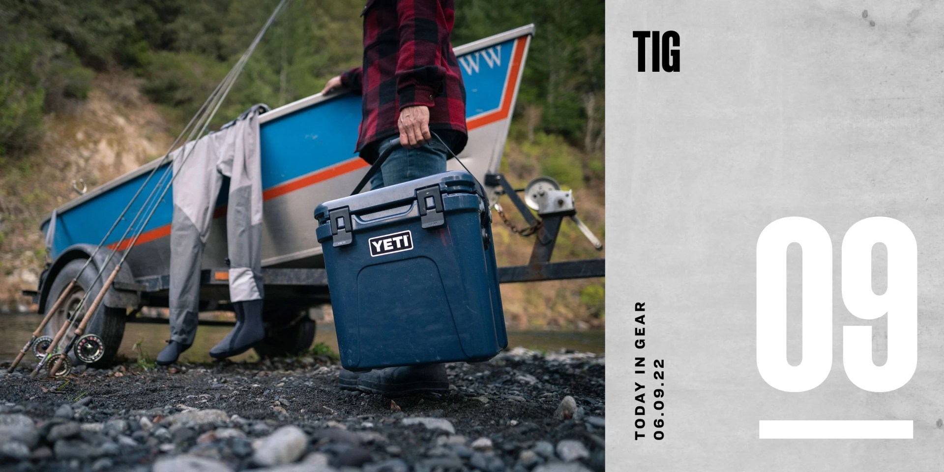 today in gear june 9 2022 academy sports man holding yeti cooler with one hand on a boat docked by the side of a river