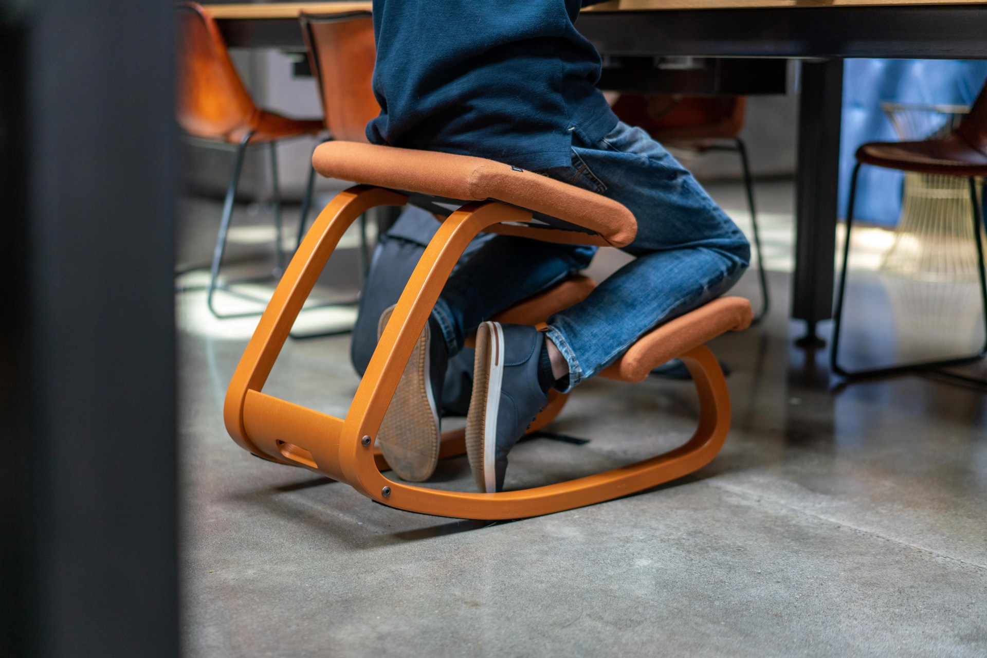 person sitting at a desk in the variable balans chair