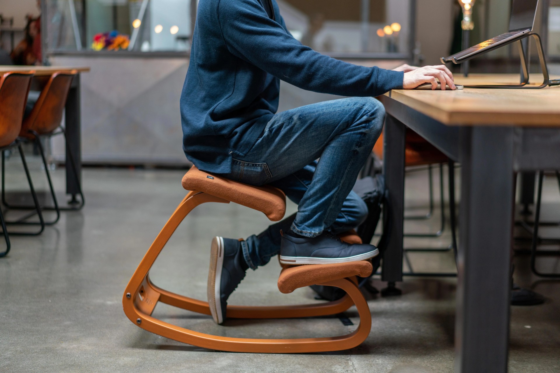 person sitting at a desk in the variable balans chair