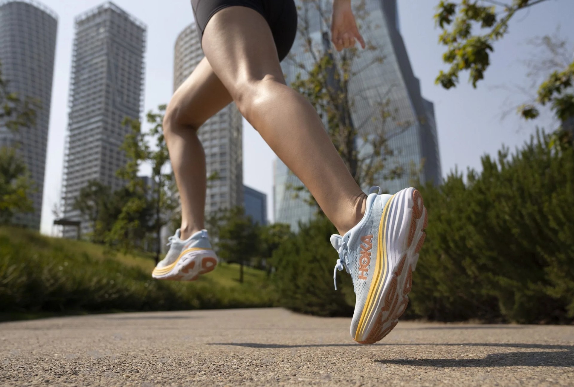 woman running in hoka bondi 8 shoes