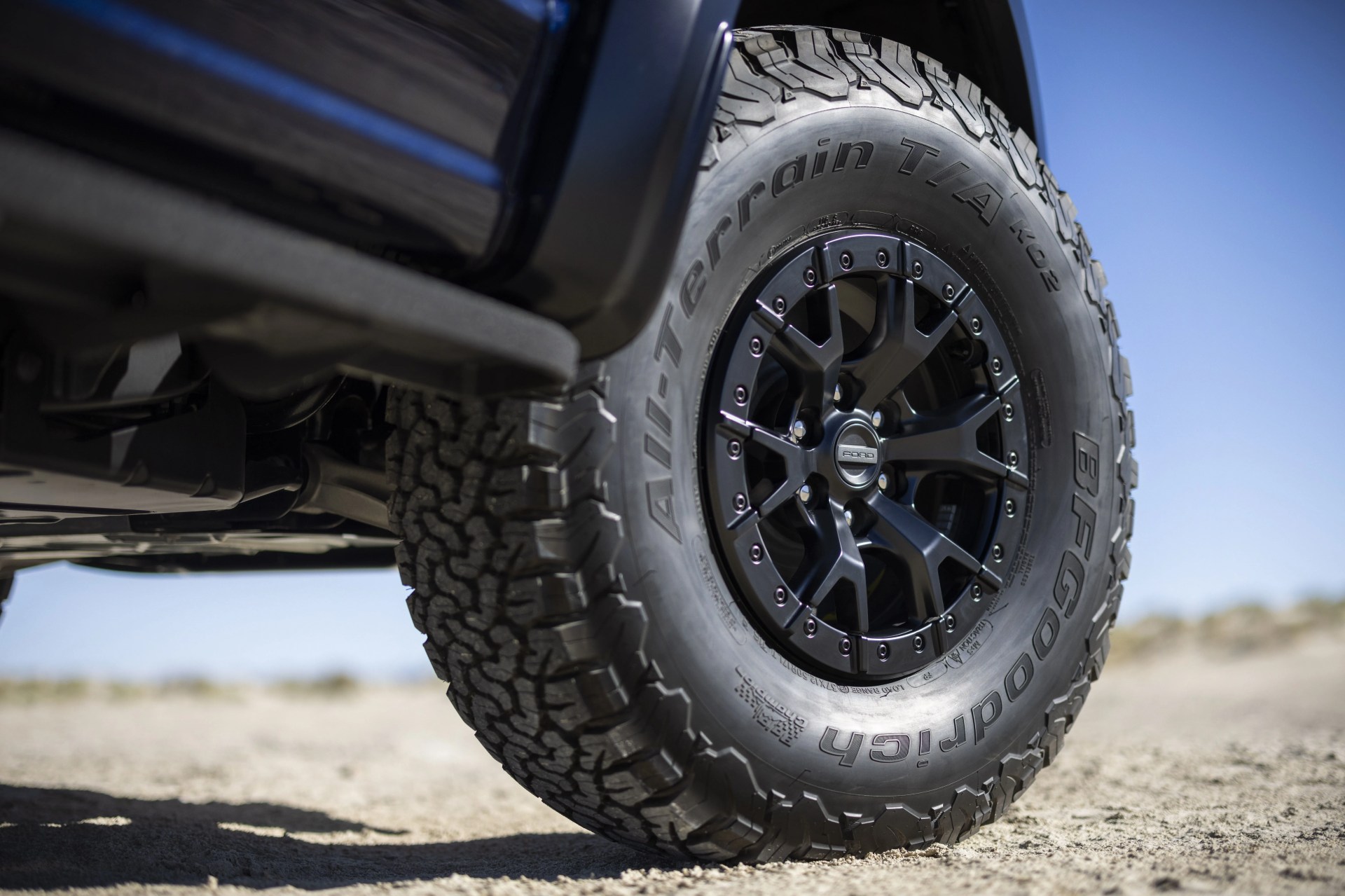 ford raptor r front right tire in the desert
