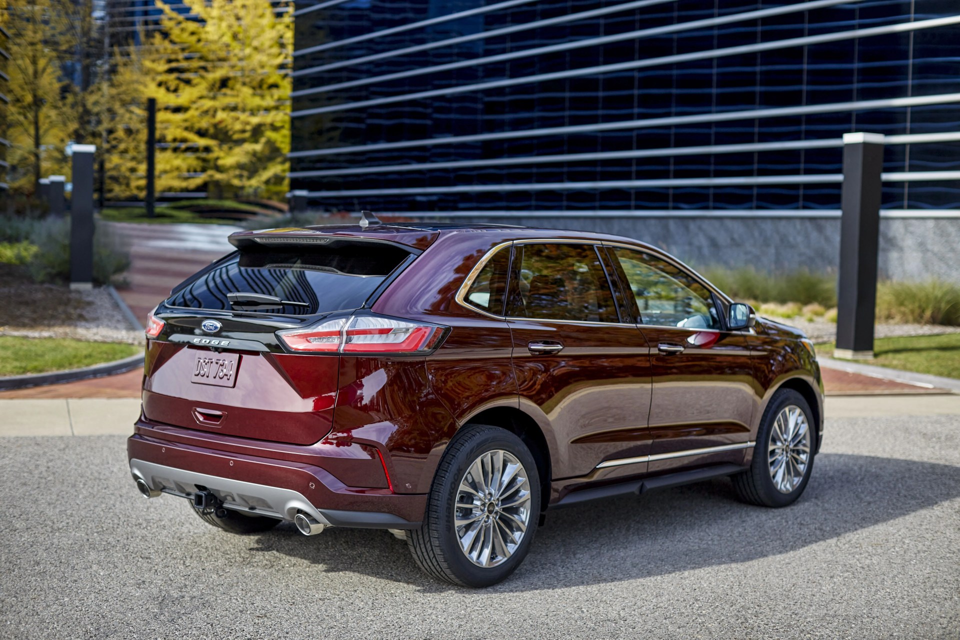 ford edge suv in front of an office building shot from the rear
