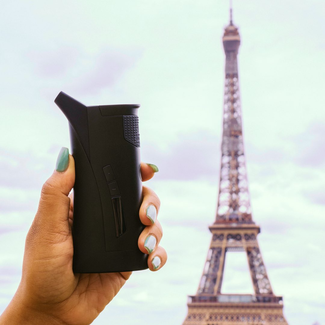 g pen roam weed vaporizer in front of the eiffel tower