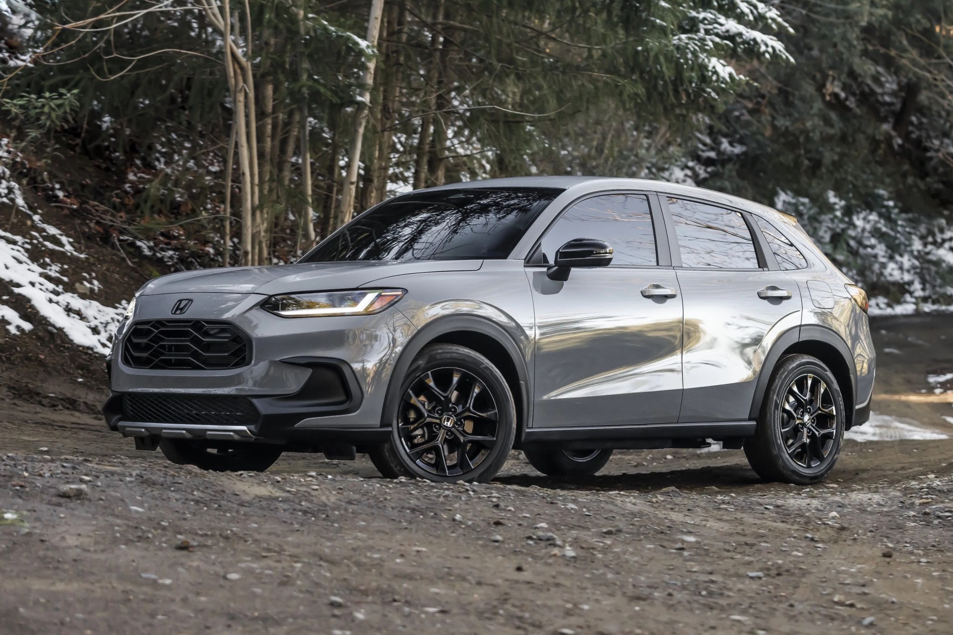 2023 honda hr v crossover parked on snowy wooded trail