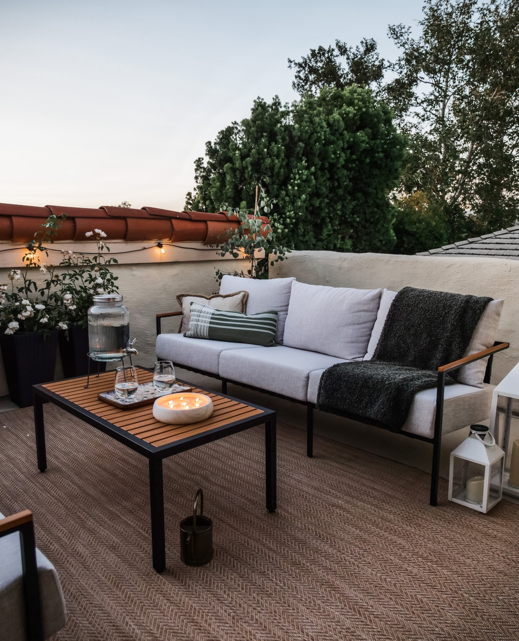 castlery outdoor patio furniture during sunset with candles