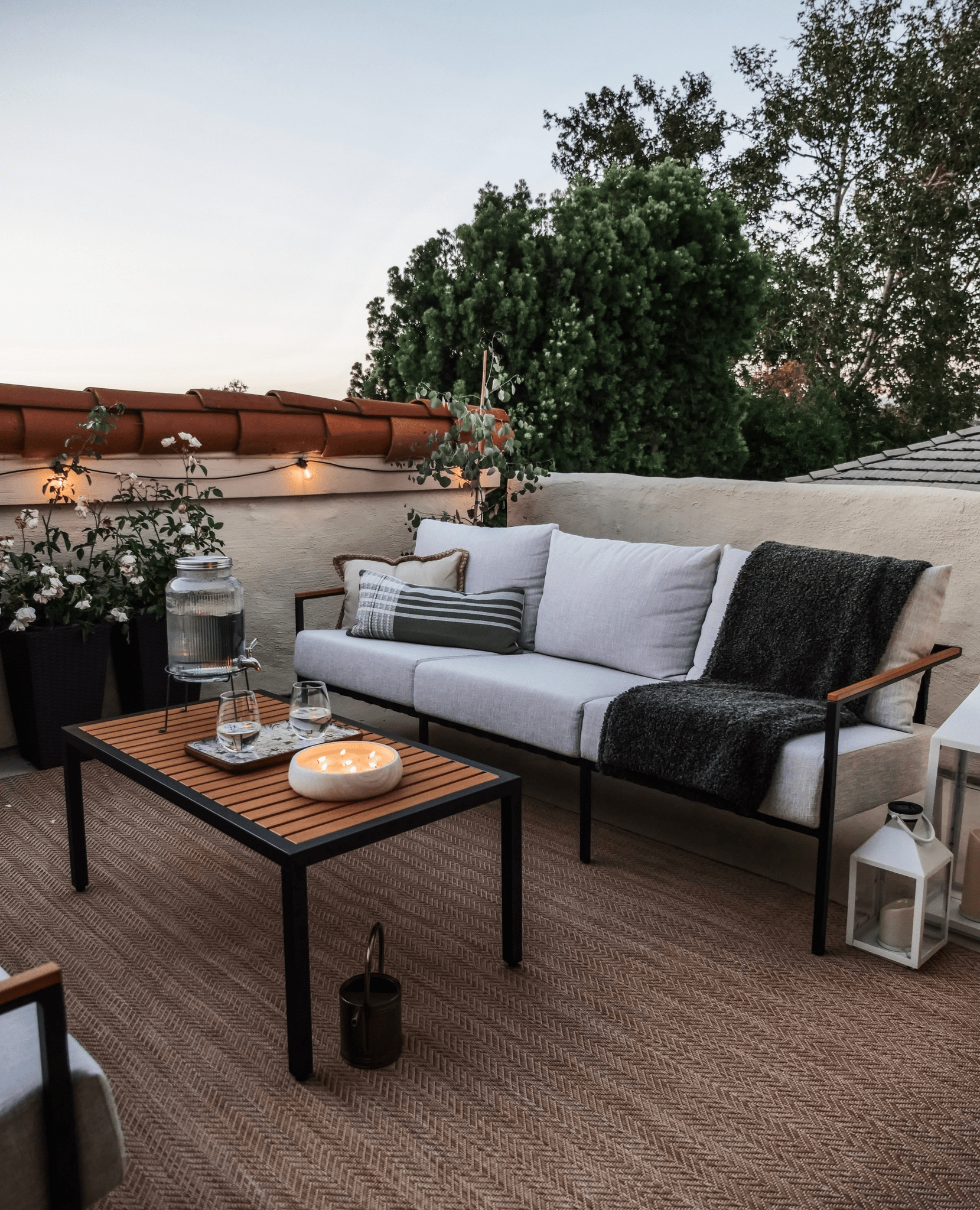 castlery outdoor patio furniture during sunset with candles