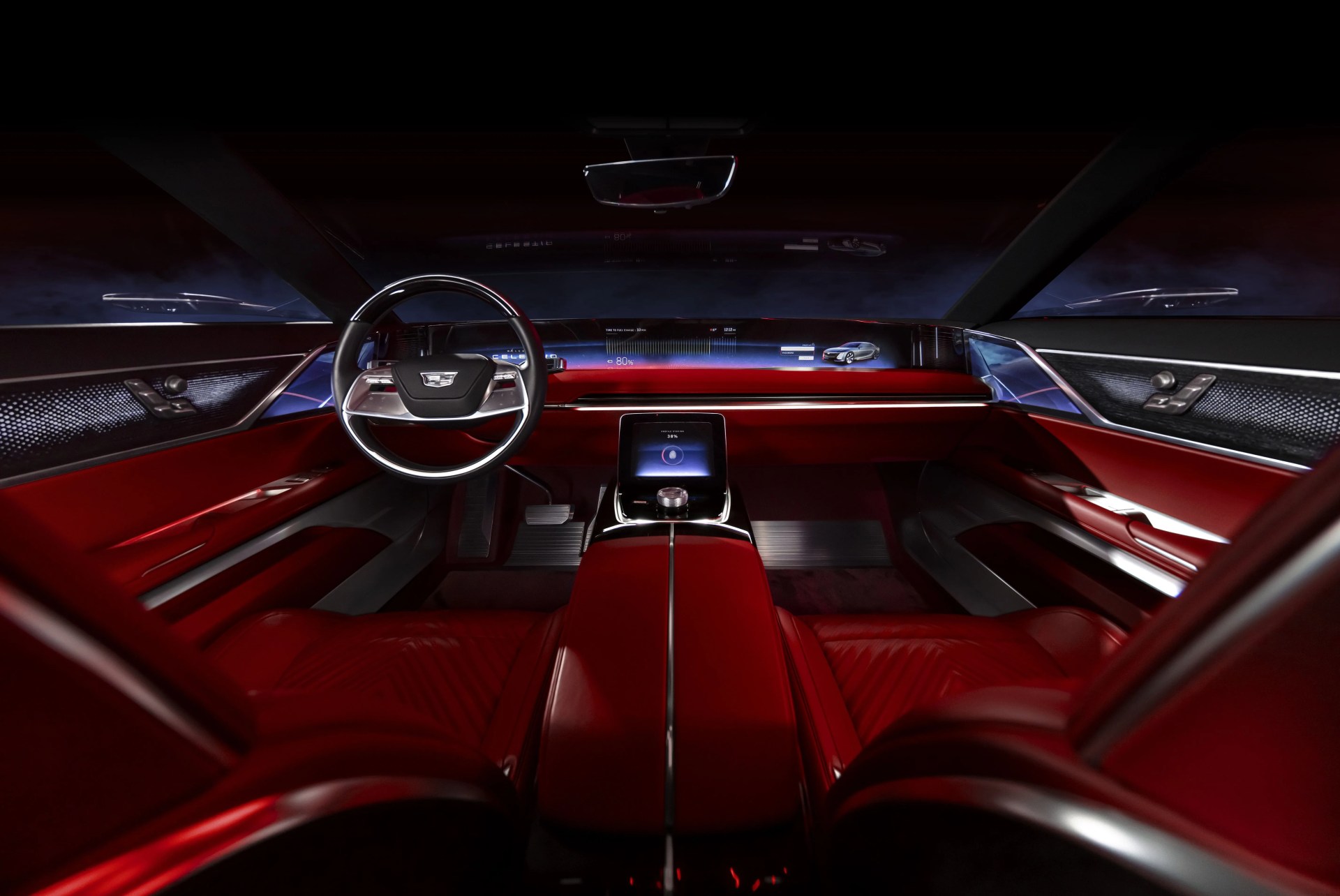 interior view of the steering wheel, 55 inch pillar to pillar advanced led screen, center console and front seats of the celestiq show car show car images displayed throughout not for sale