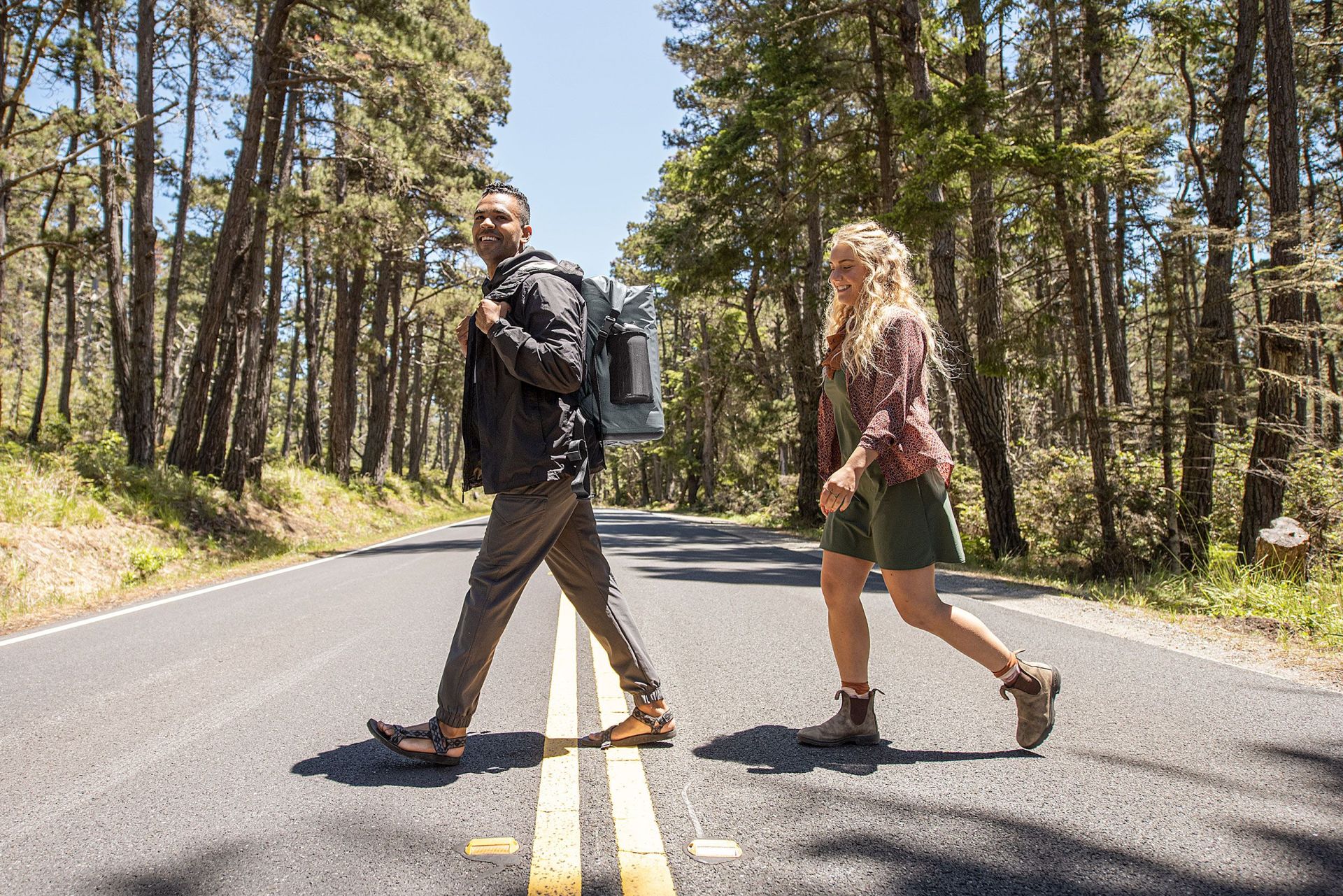 man and woman crossing the street wearing camelbak chillbak pack 30