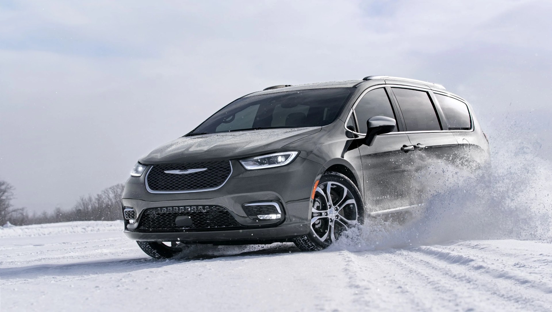 chrysler pacifica minivan with all wheel drive performing a powerslide in snow