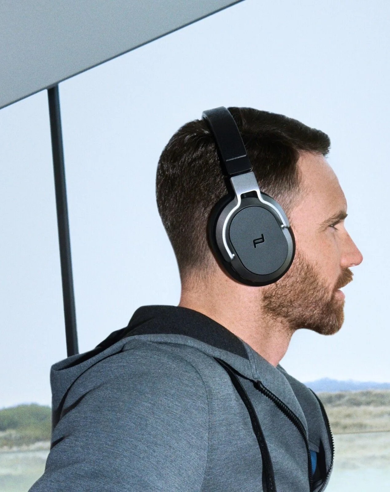 man wearing porsche design headphones pdh80