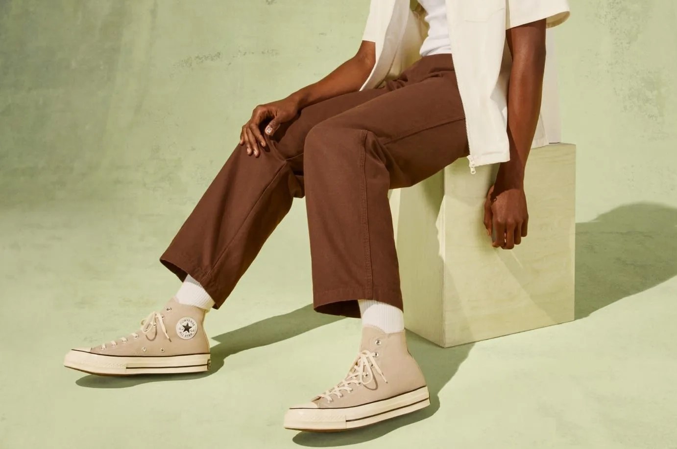 man wearing converse shoes