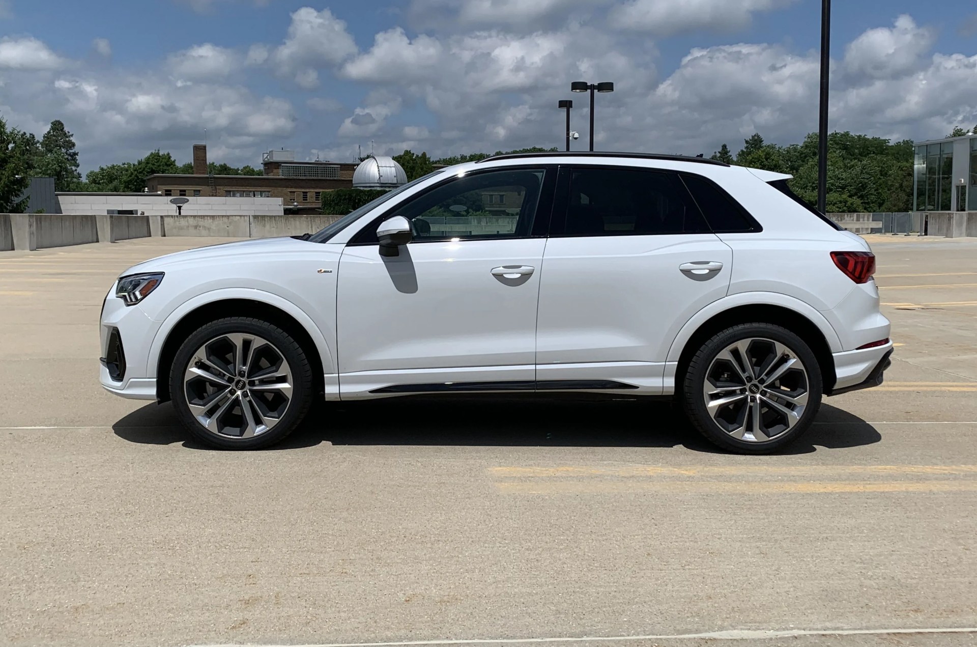 audi q3 viewed from the side parked in a parking lot