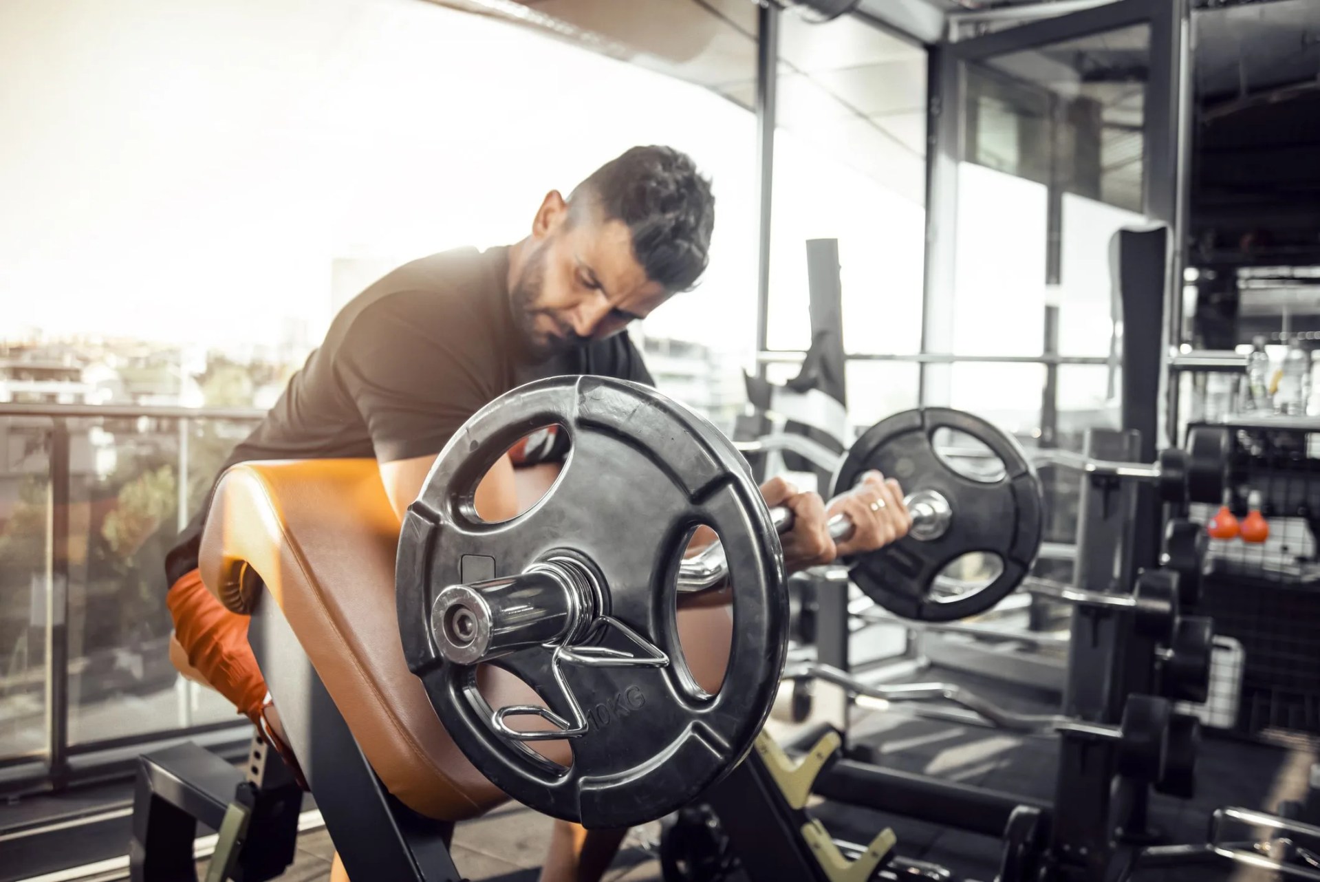 a man doing arm workout with barbell at gym barbell biceps curl exercise