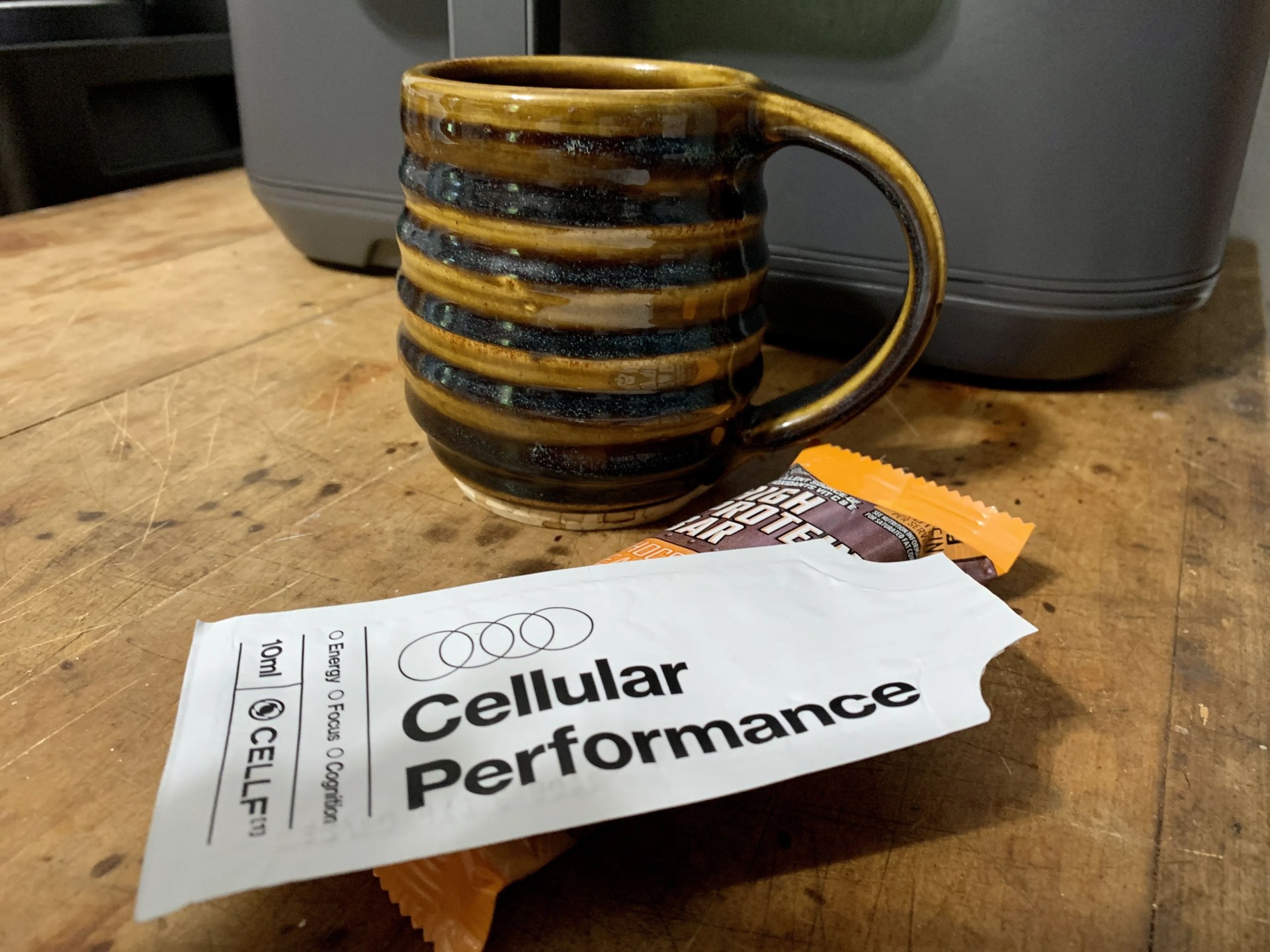 coffee, protein bar, and packet of mikra cellf