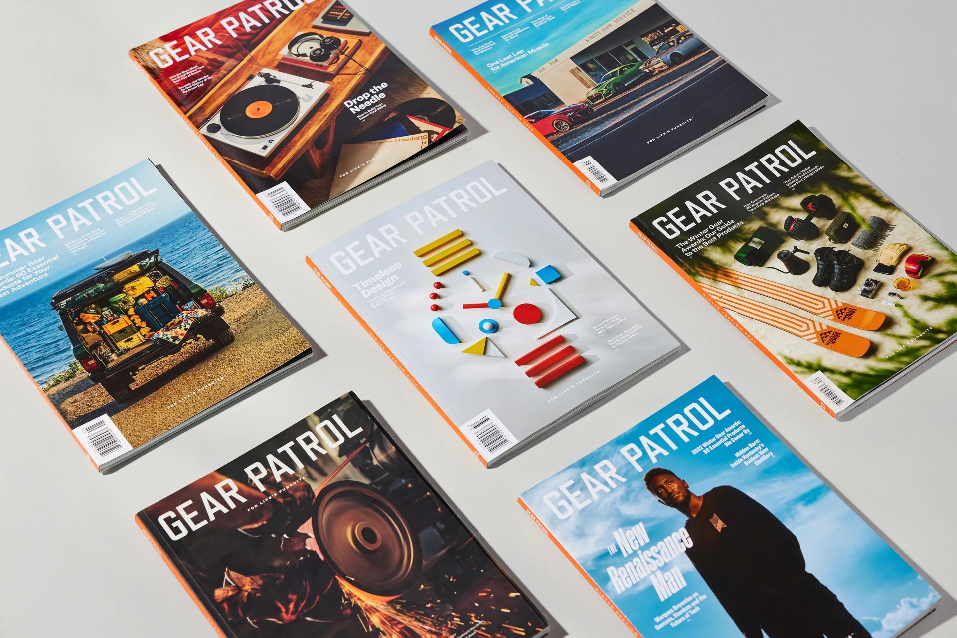 gear patrol magazine issues on a table