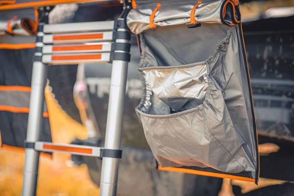 roofnest condor xl tent gear bag next to the entry ladder