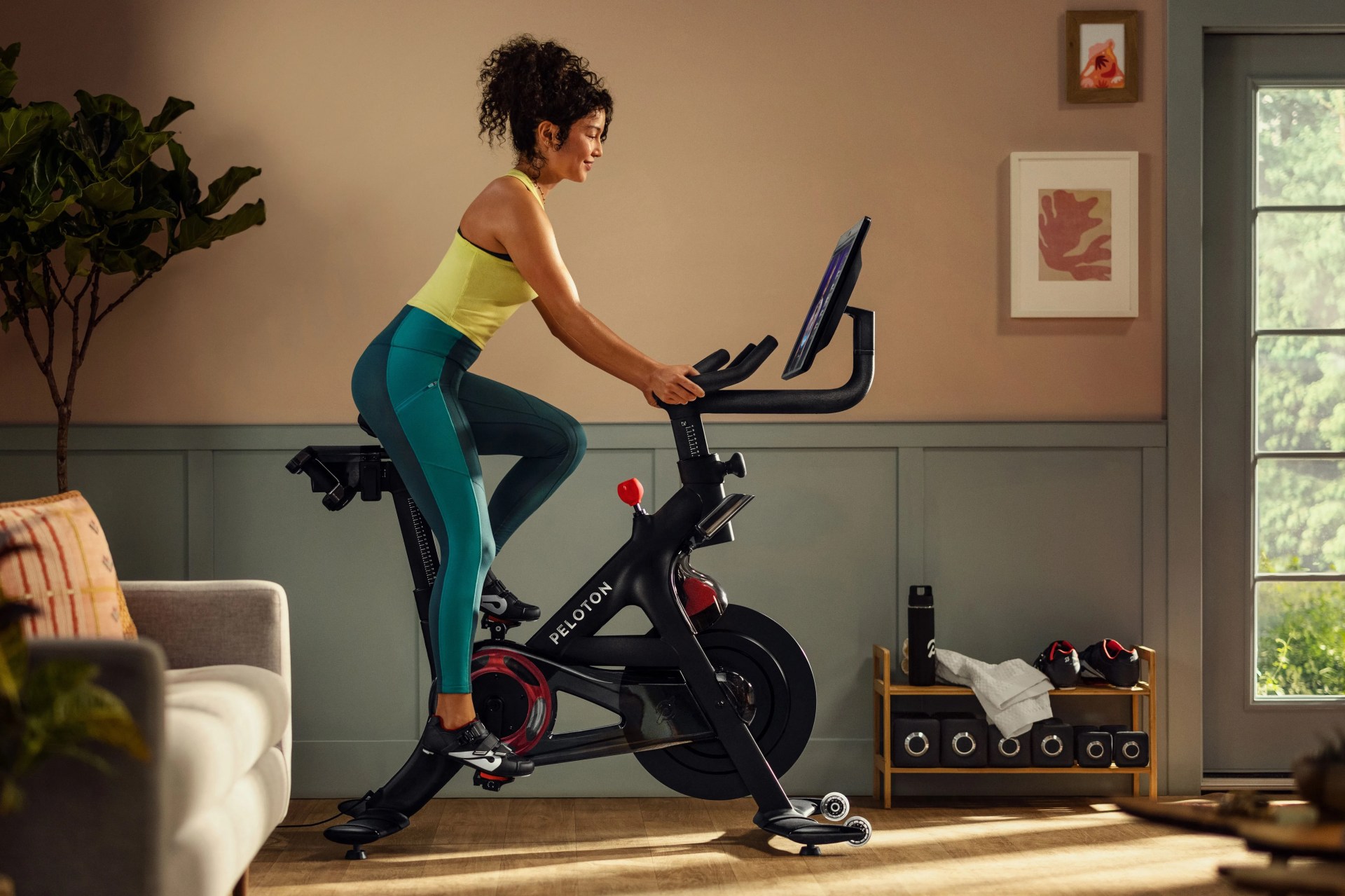 woman riding a peloton bike