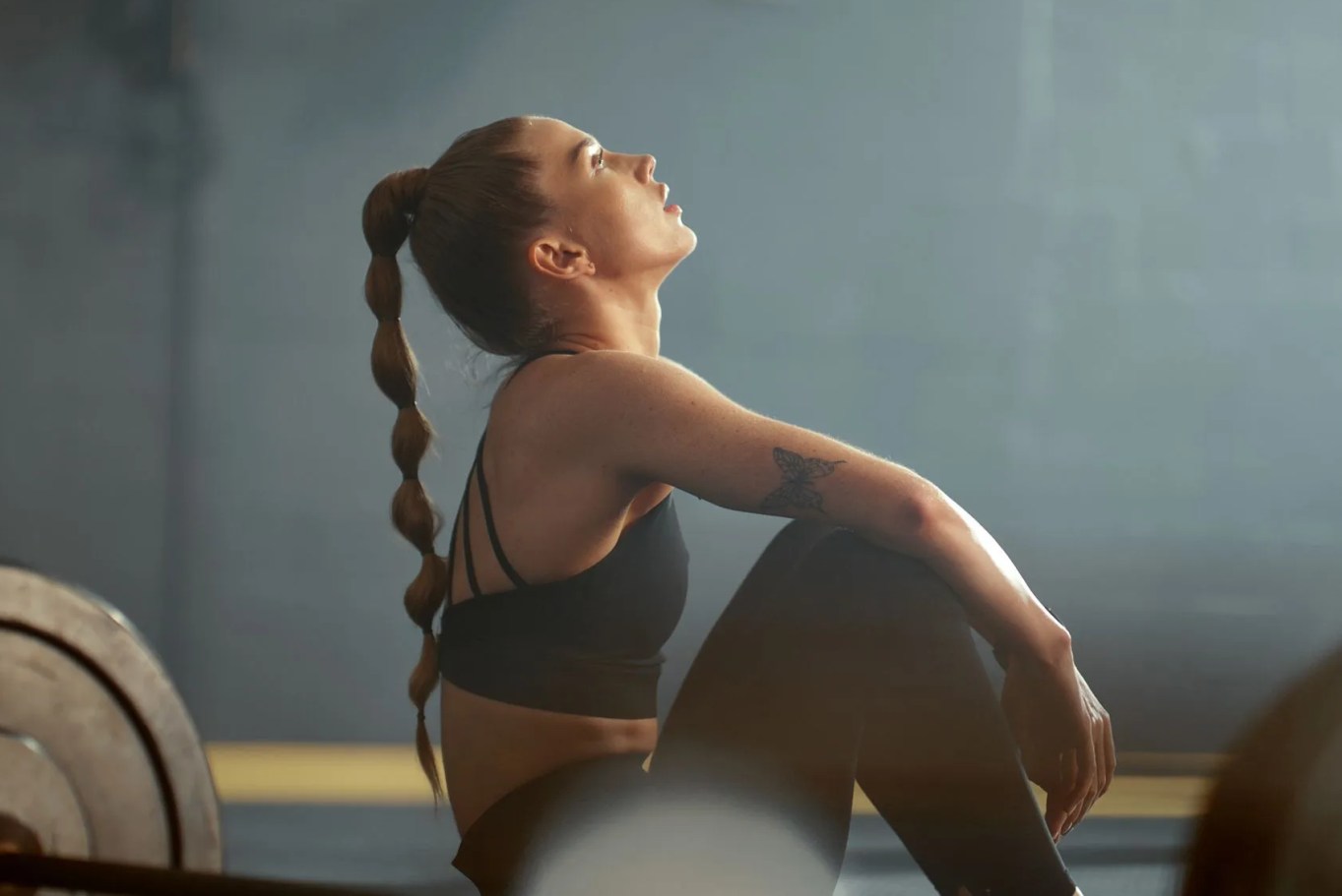 fitness, break and tired, exercise routine and woman in gym, weight lifting and active lifestyle training health and wellness motivation, rest after workout and strength, endurance and to be fit