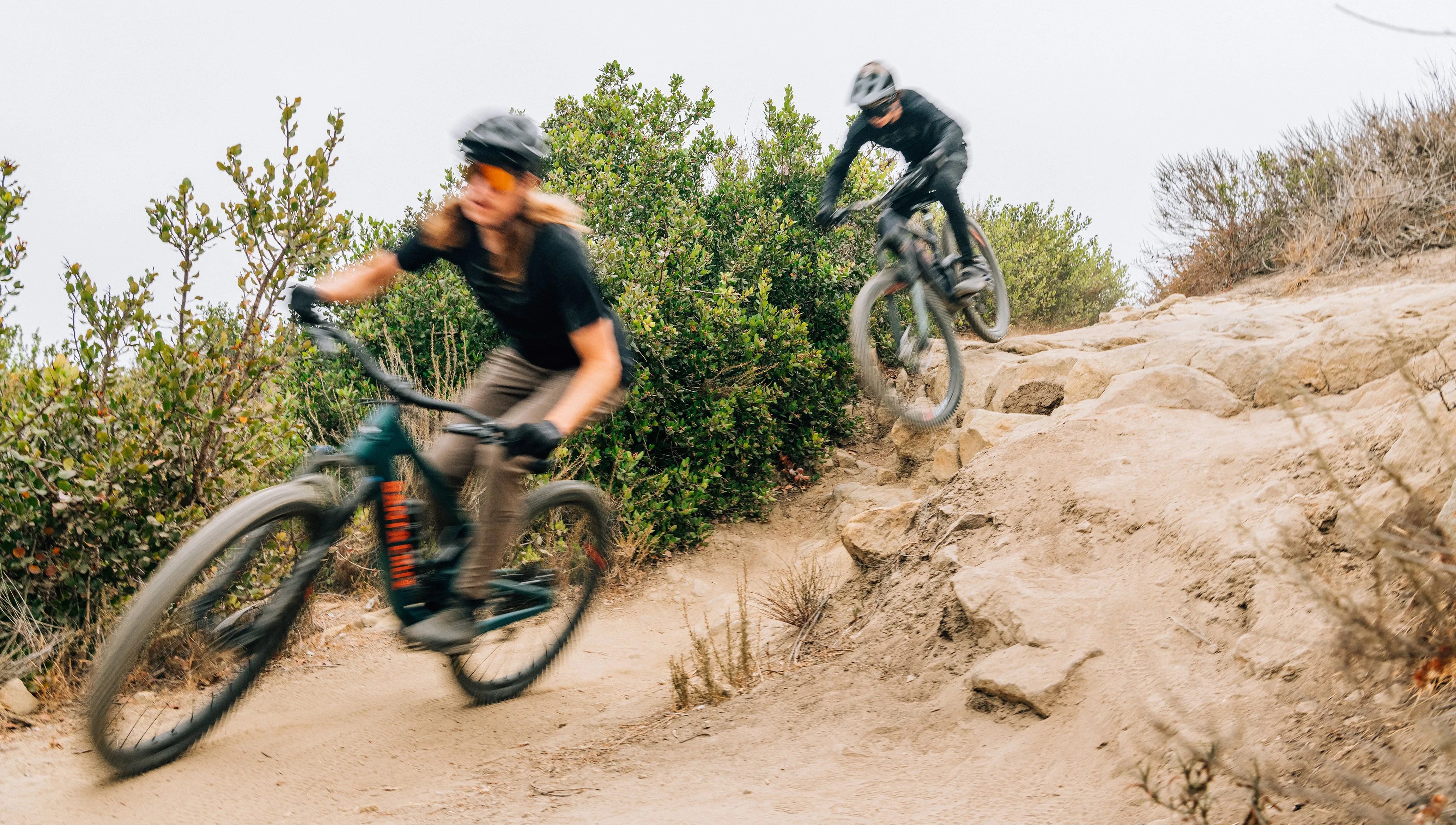 men riding bikes with fox racing gear