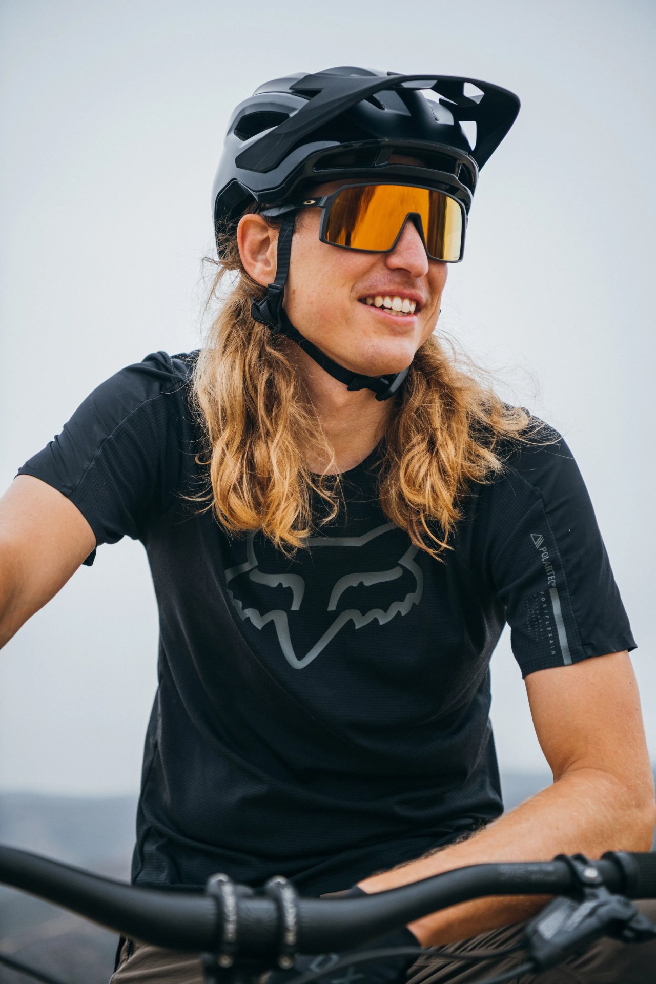 men riding bikes with fox racing gear