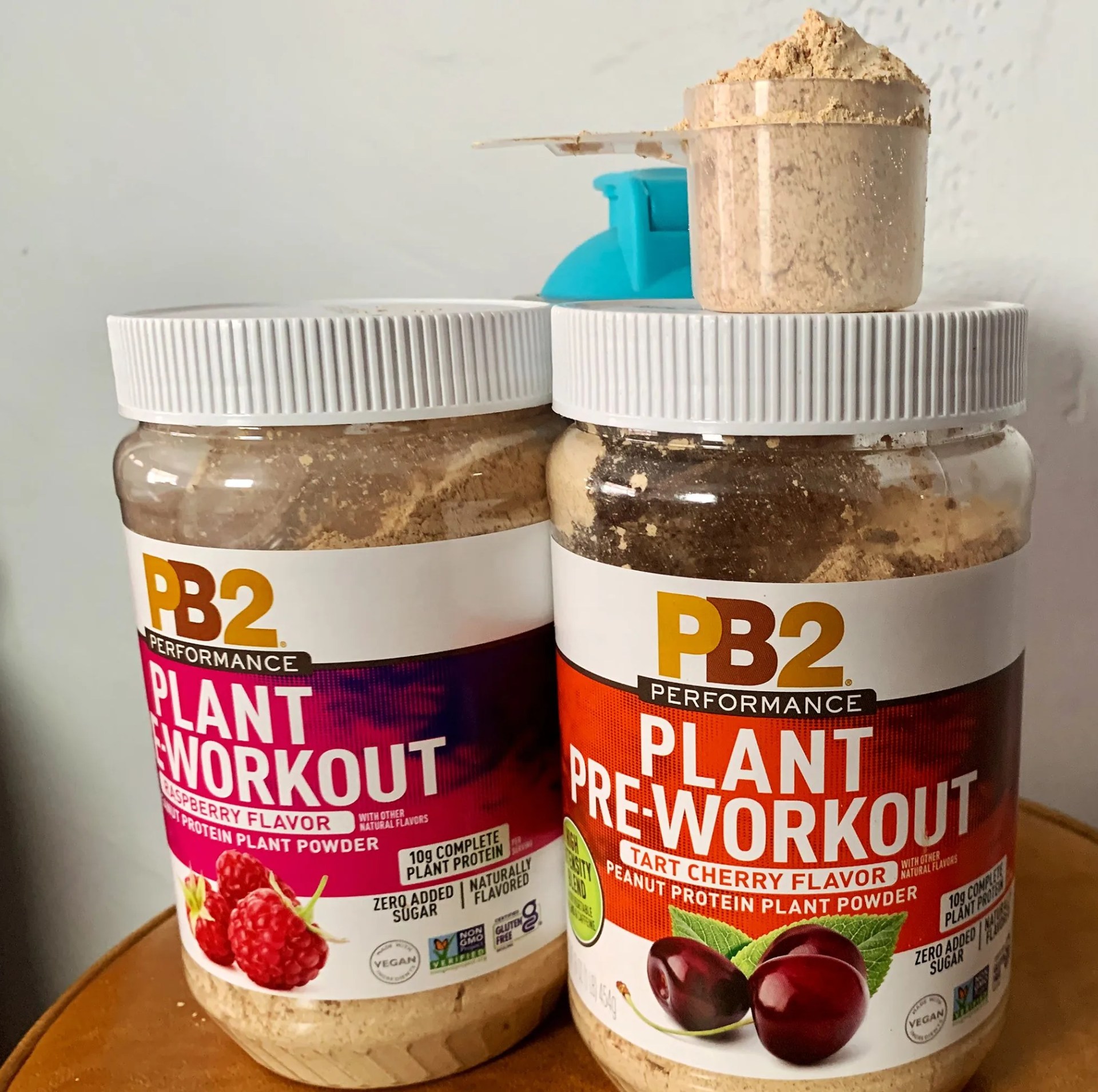 jars of pb2 plant pre workout flavors of raspberry and tart cherry