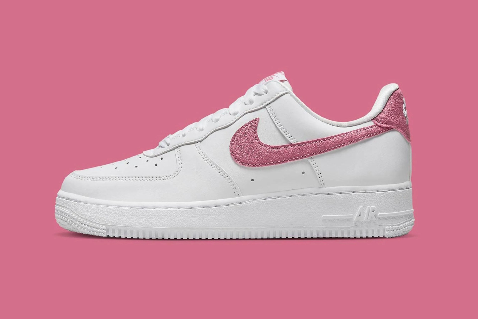 pink and white nike sneaker