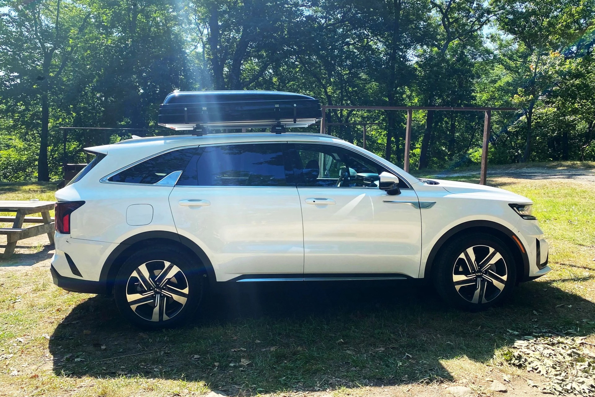 roofnest condor xl tent box on top of a white kia