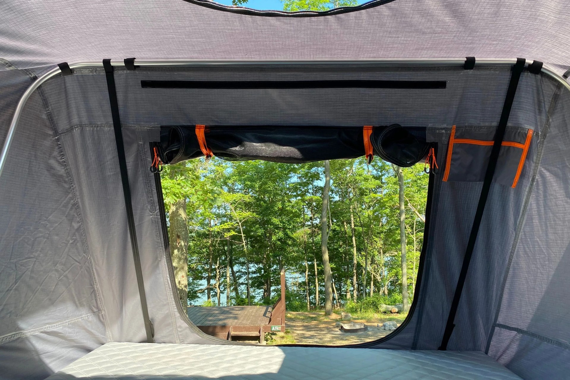 inside of the roofnest condor xl tent looking out through the screened door