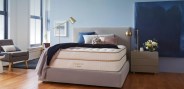 saatva mattress on a gray bed frame
