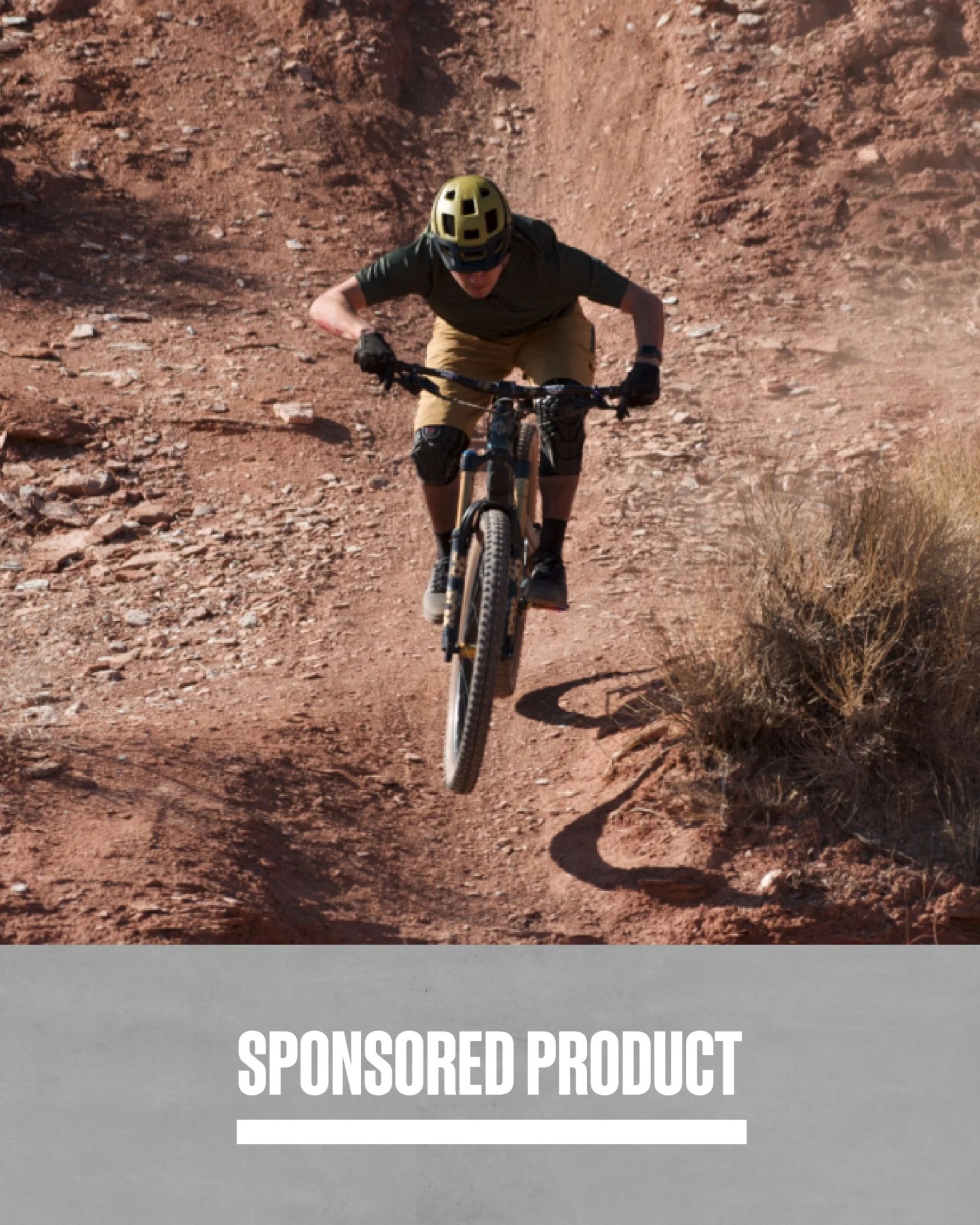 sponsored product man riding bike downhill wearing backcountry gear