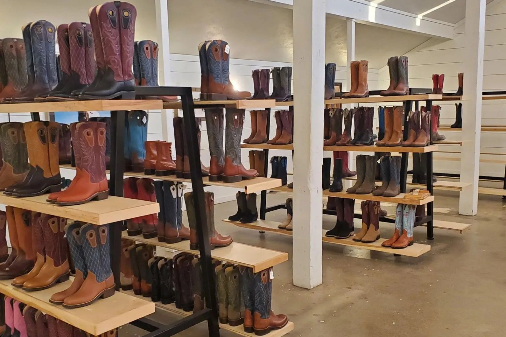 cowboy boots on shelves in a store