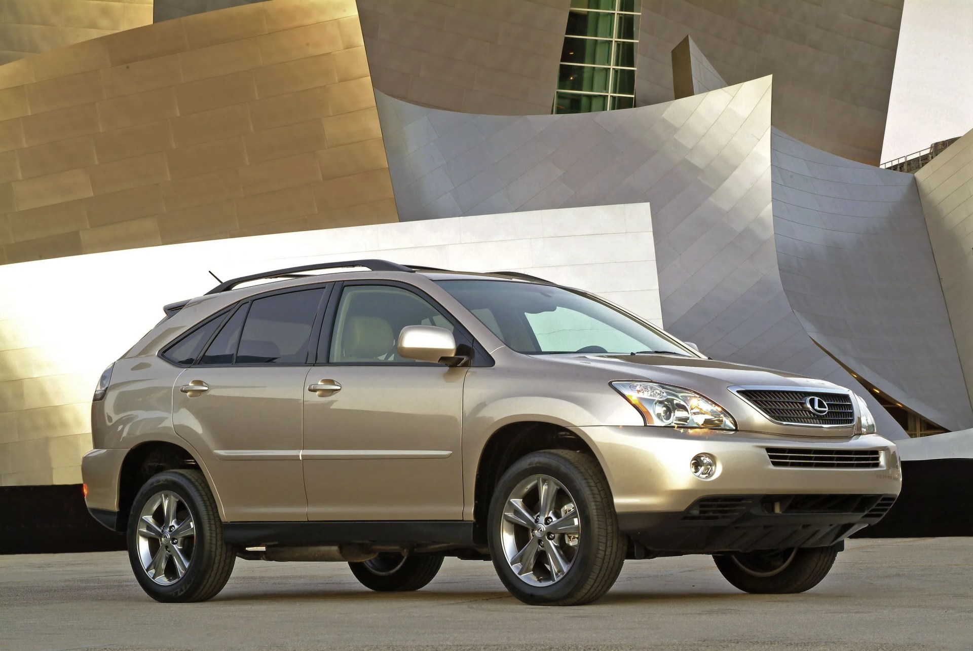lexus rx 400h parked in front of a modernist building