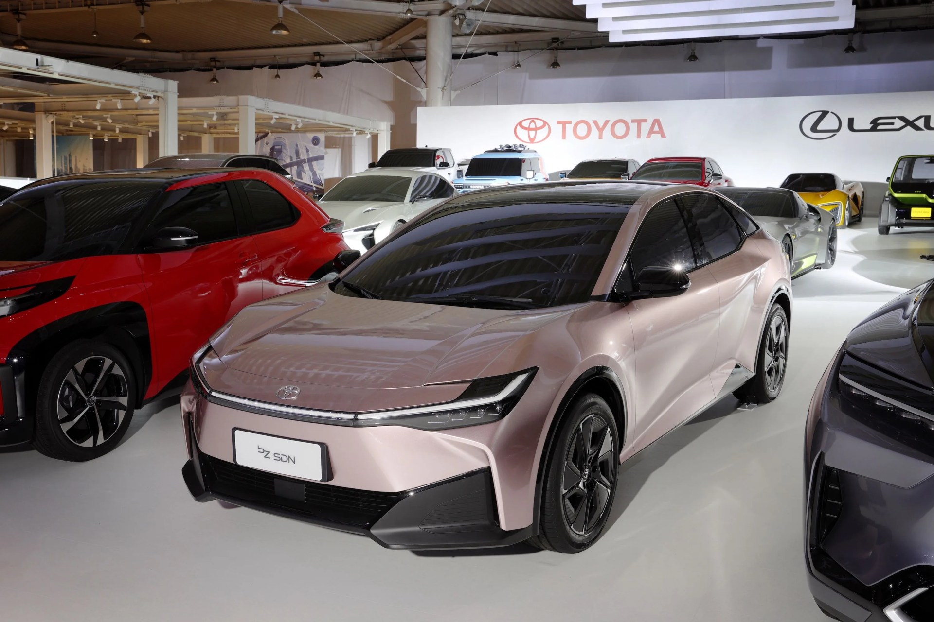 toyota bz sdn concept parked with other electric car concepts in a studio