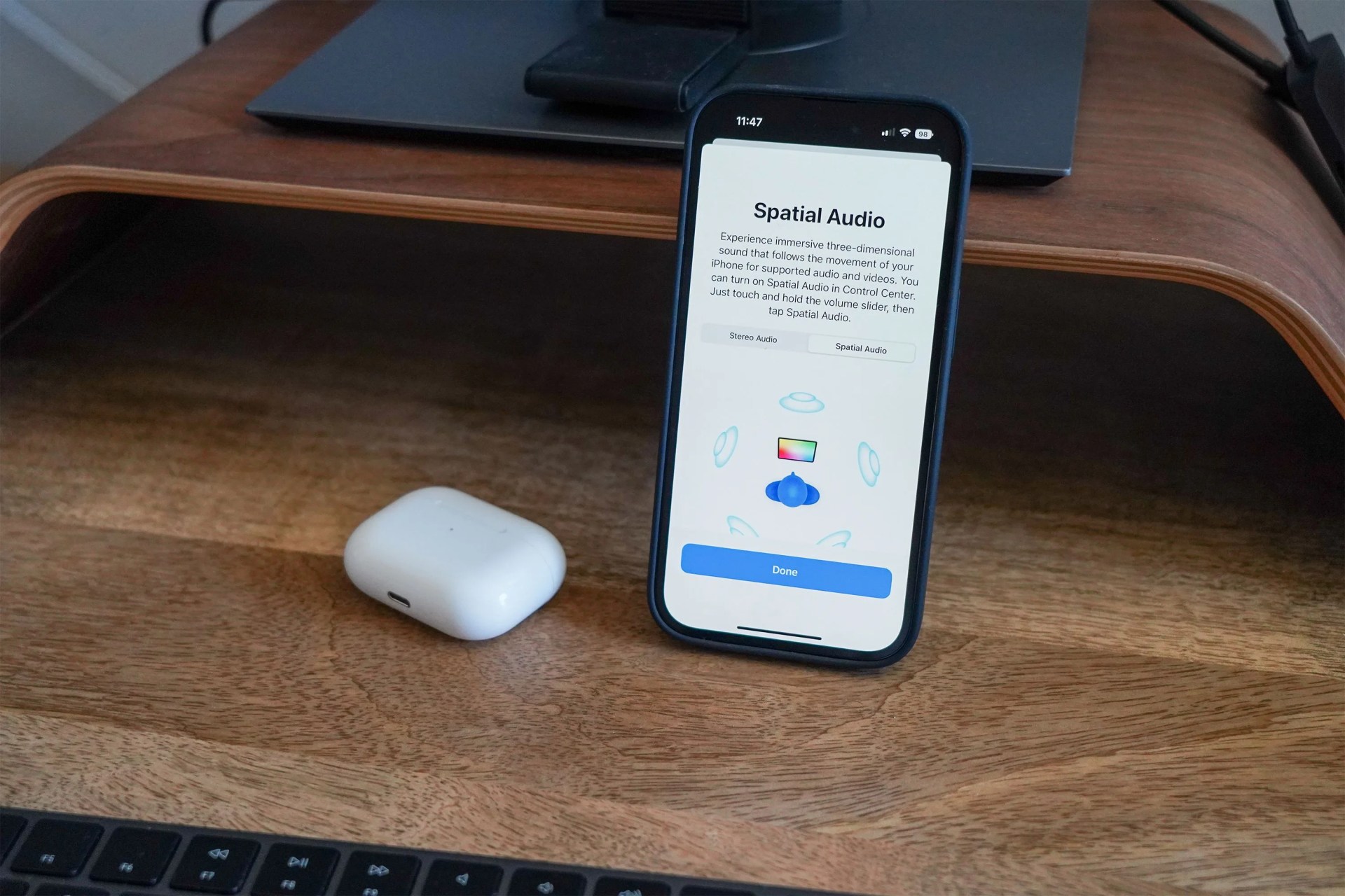 airpods 2 next to an iphone on a desk