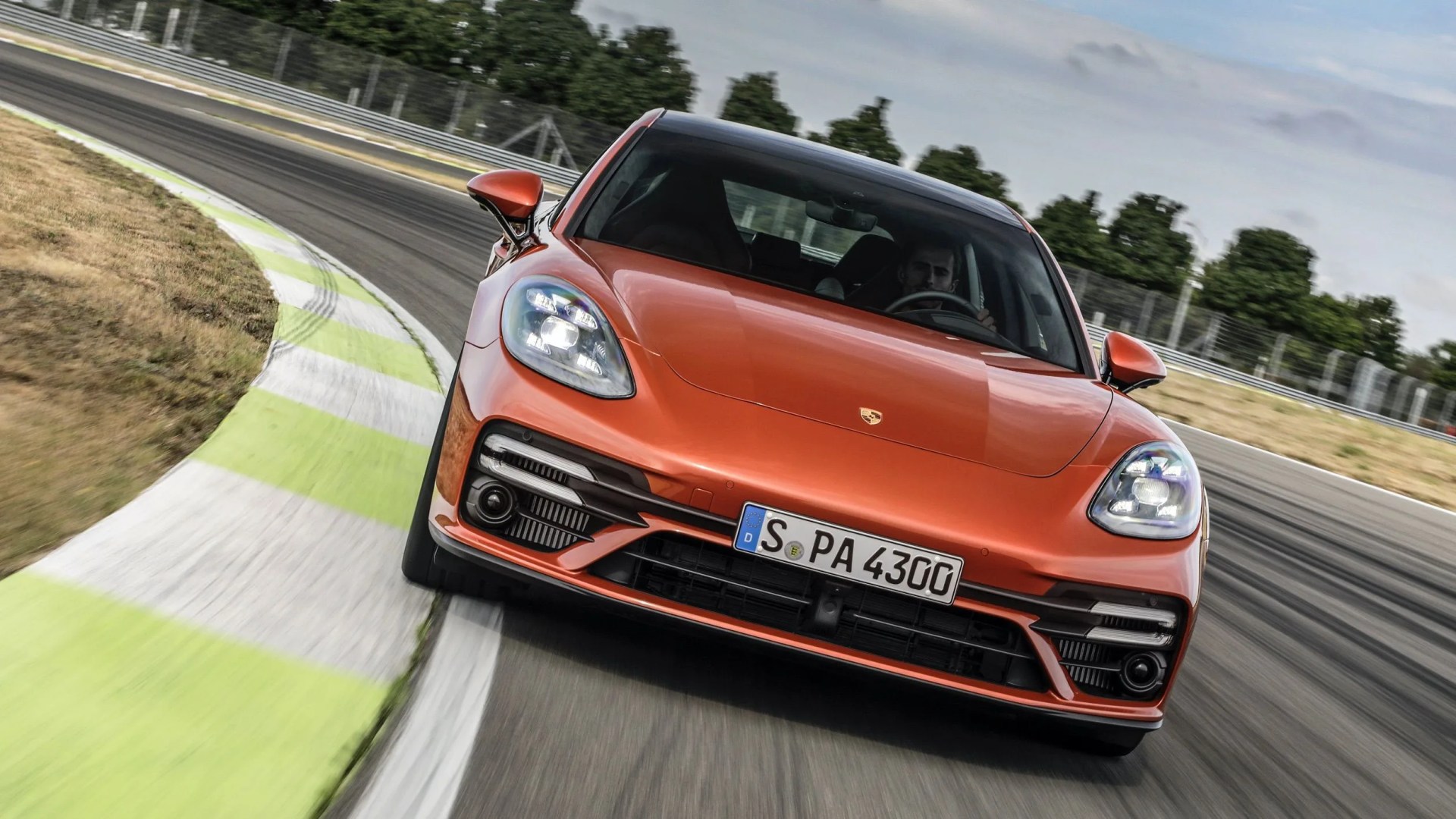 porsche panamera hitting the apex of a corner on track