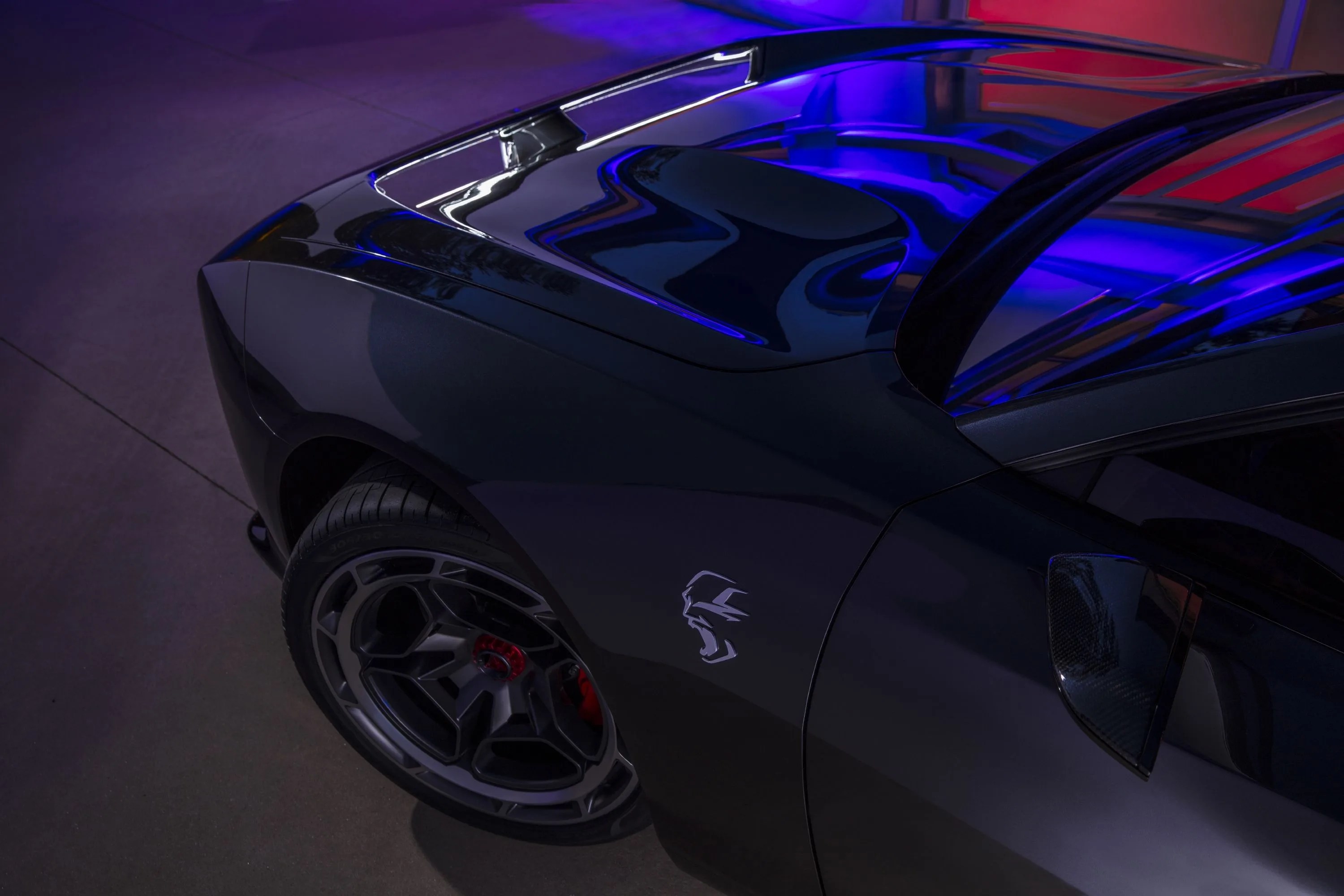brushed aluminum “screaming” banshee fender badges announce the new propulsion system that drives the dodge charger daytona srt concept