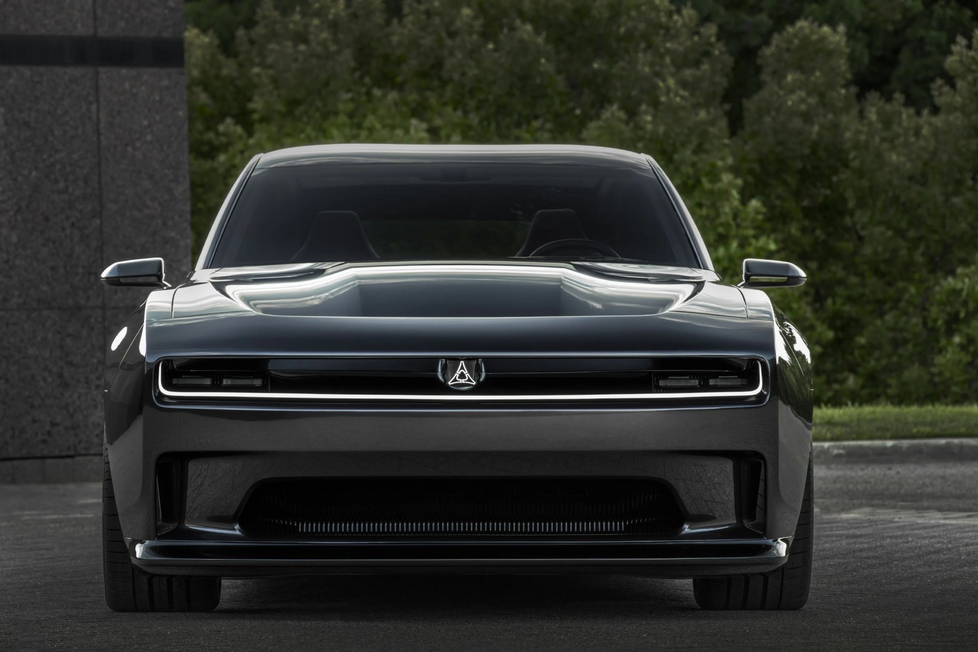the dodge charger daytona srt concept combines modern looks with a long, wide and confident road presence the front grille stands out with cross car illuminated lighting centered by a white illuminated fratzog badge
