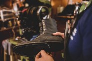 man making a custom leather boot