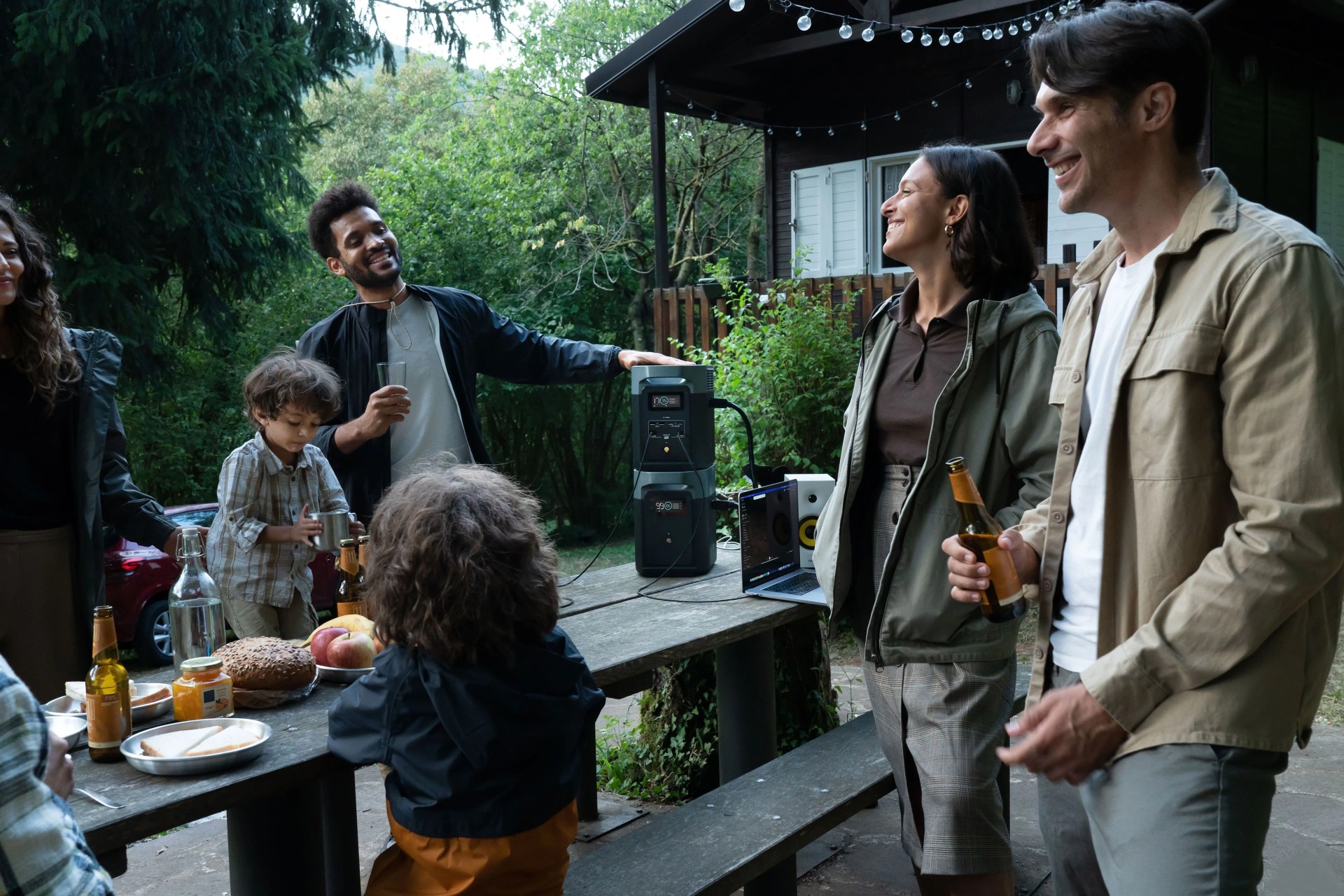 family enjoying a party in their backyard using ecoflow delta 2 portable power station