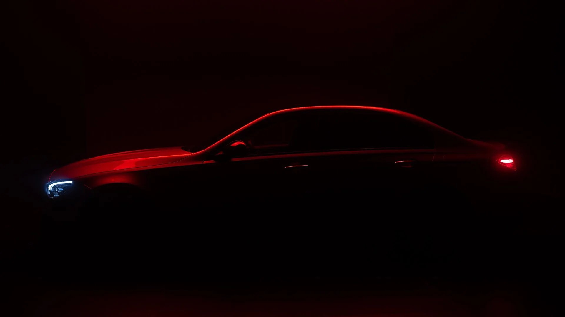 dark teaser photo showing the silhouette of the new mercedes amg c63 sport sedan
