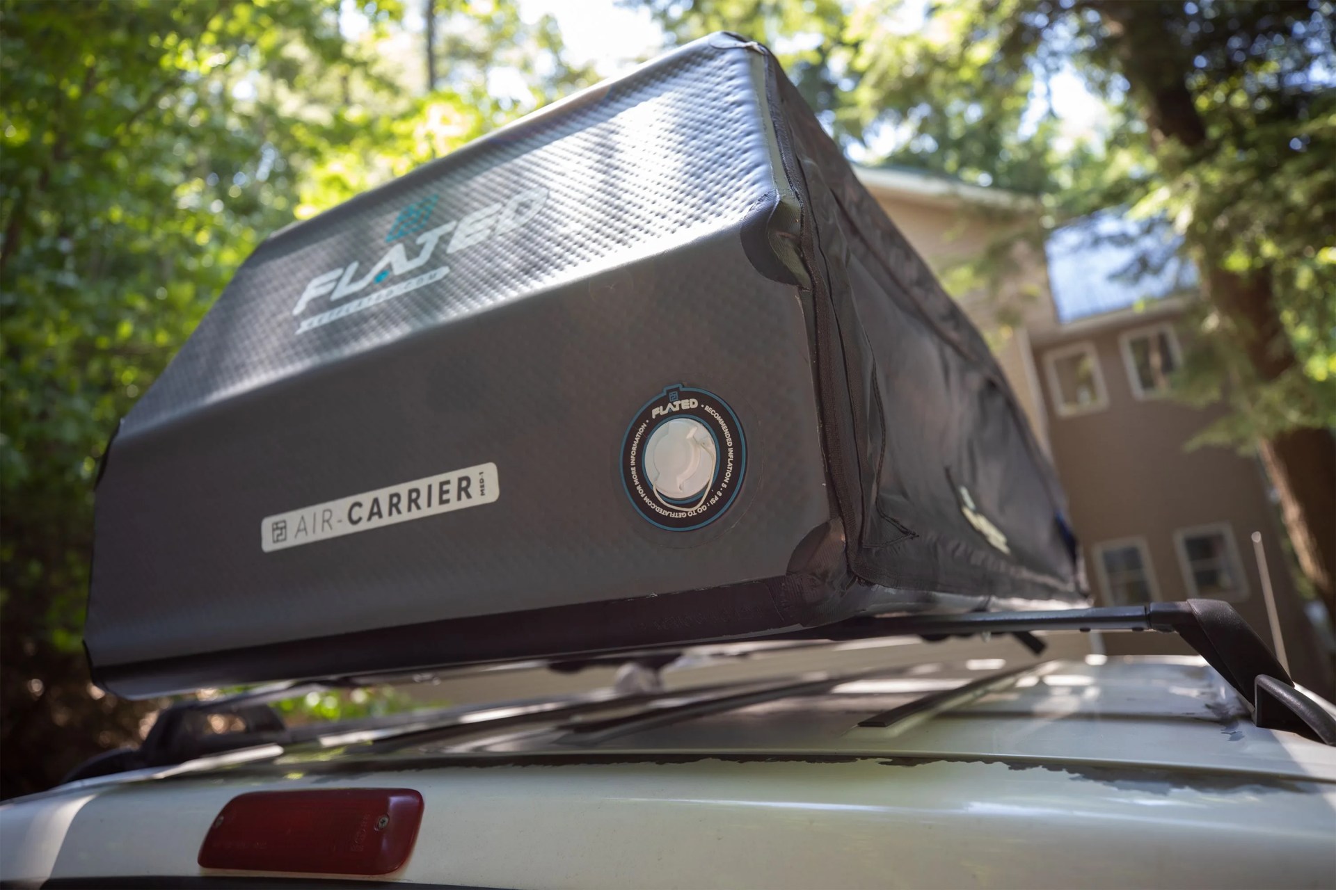 flated air carrier on top of a jeep