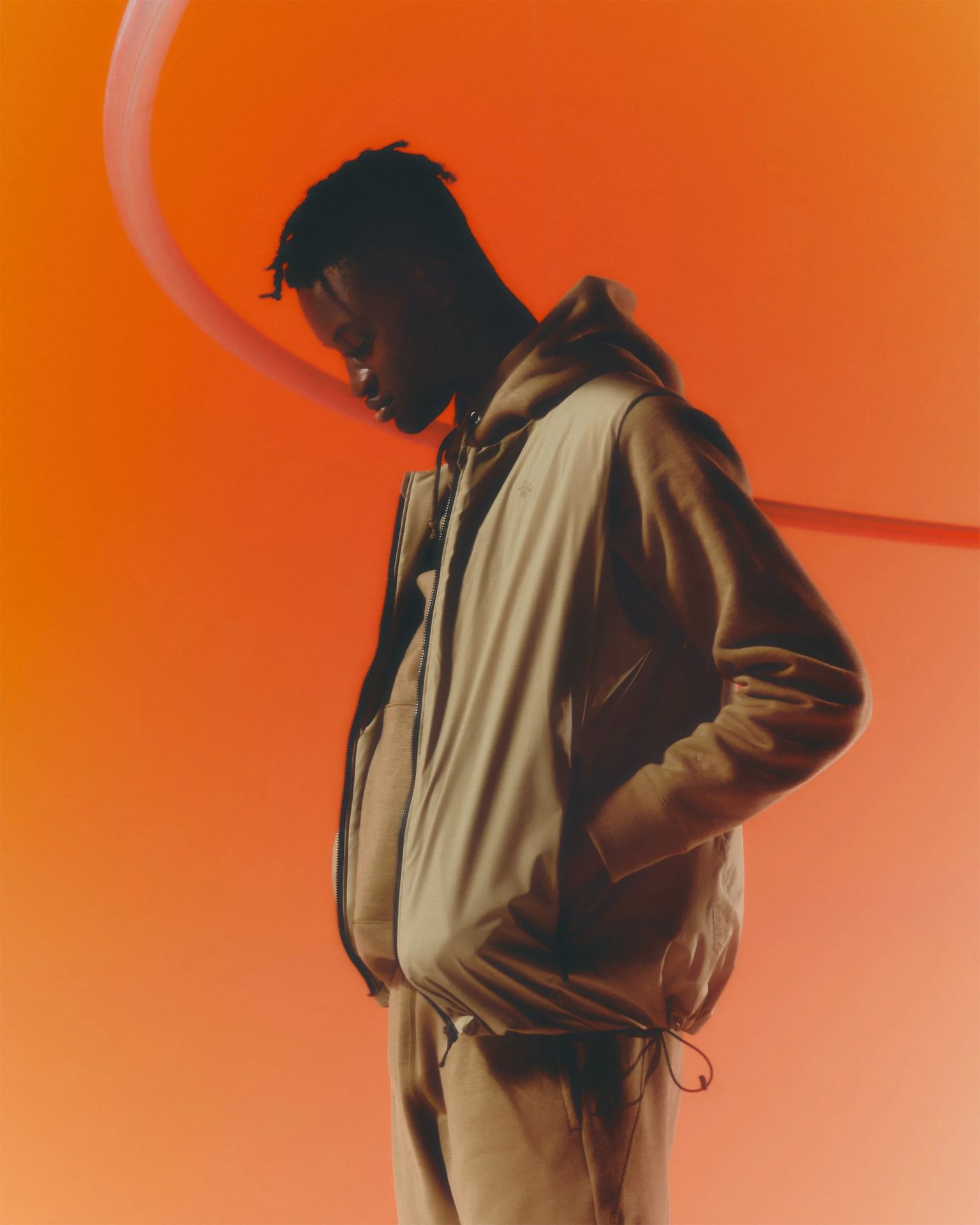 man wearing a tan outfit