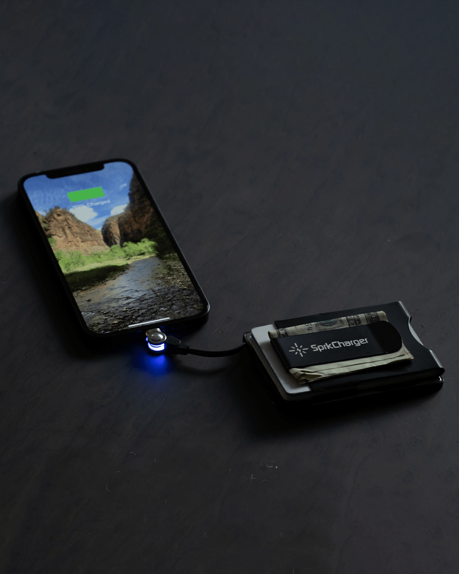a sprkcharger wallet charging an iphone