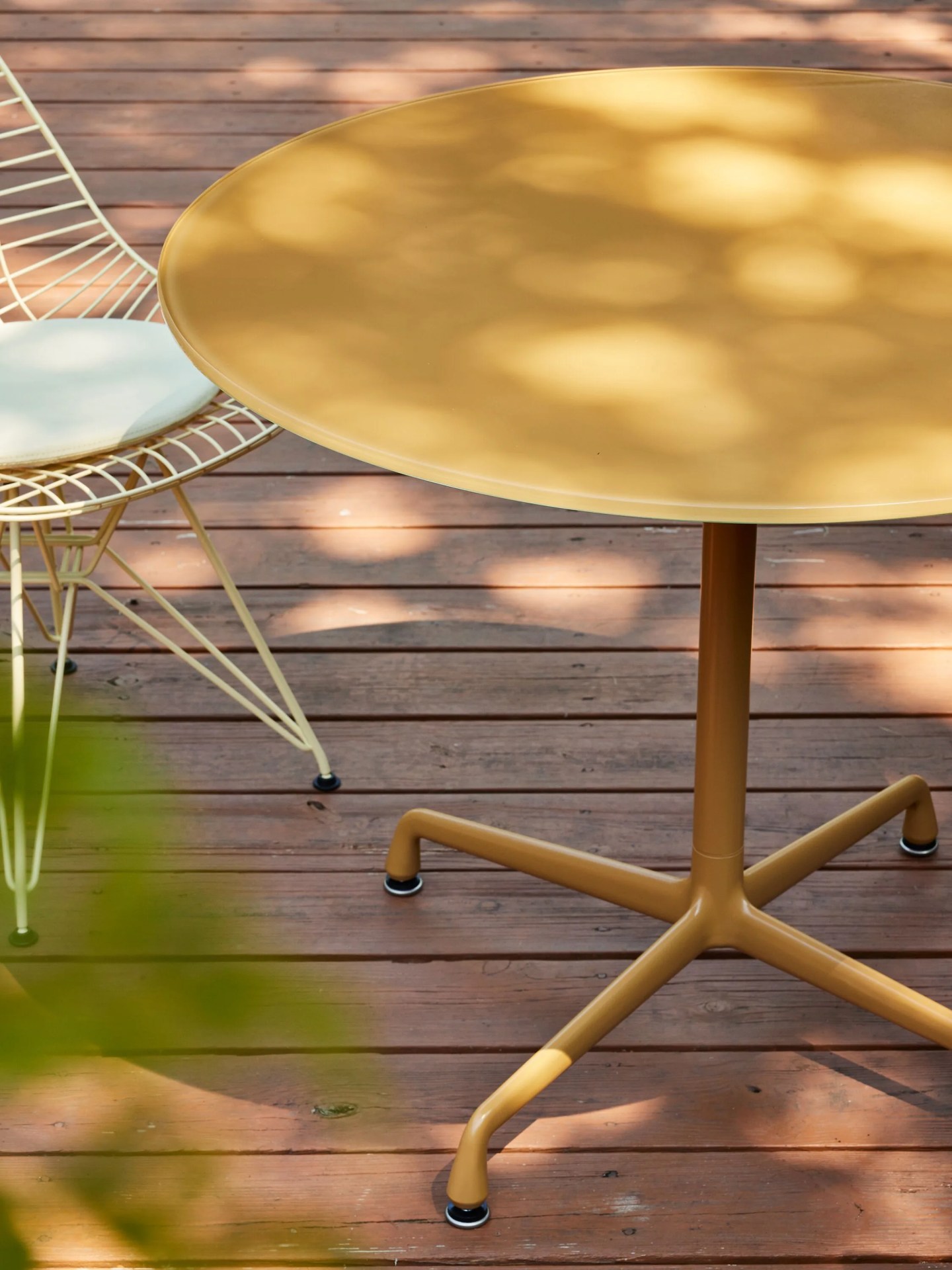 yellow table on a wooden patio
