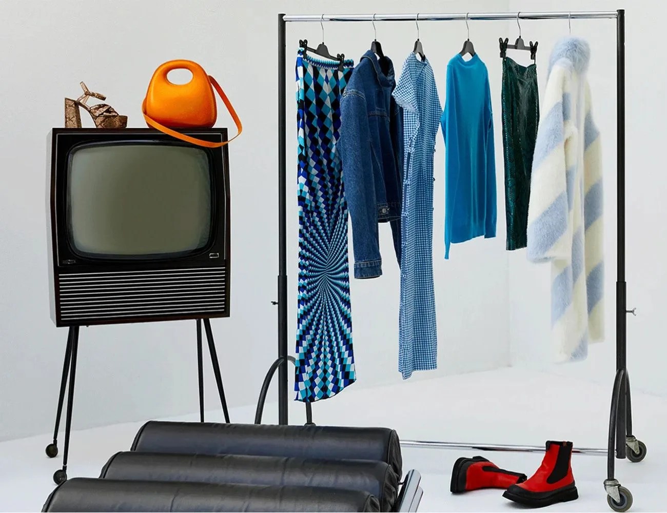 vestiaire collective rack of clothing and tv
