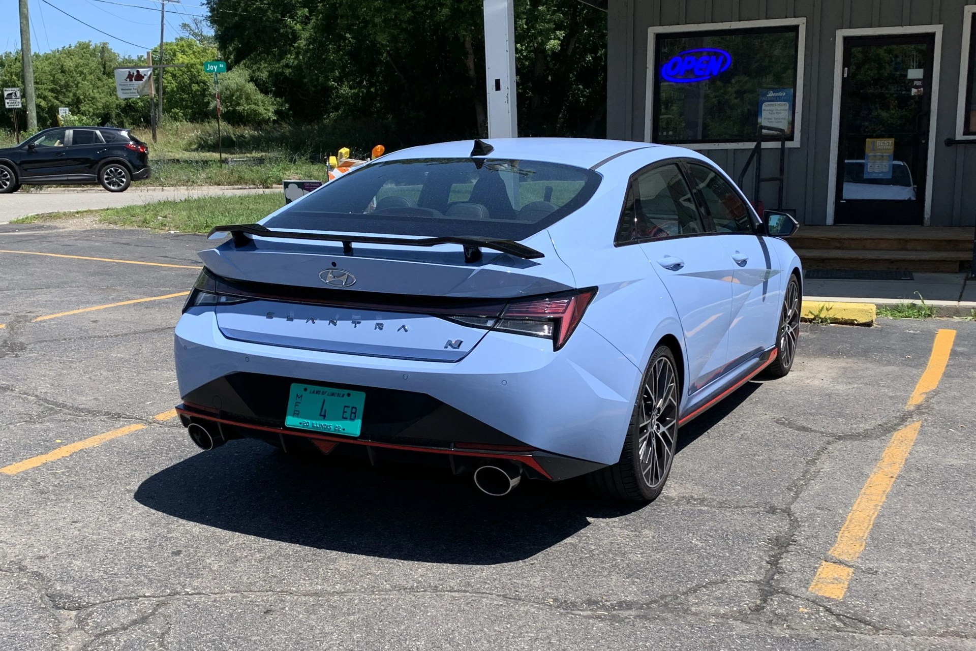 hyundai elantra n from the rear in front of a store front