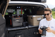 a jackery solar generator 1000 pro placed in the back of a truck charging a mavic drone