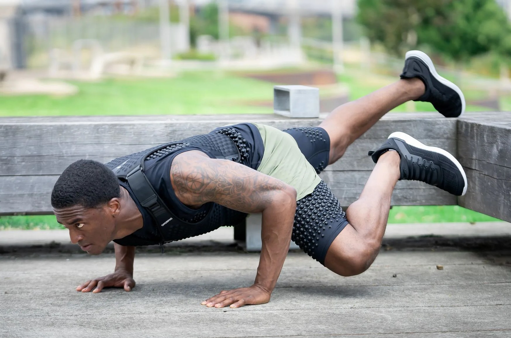 man exercising while wearing omorpho g vest