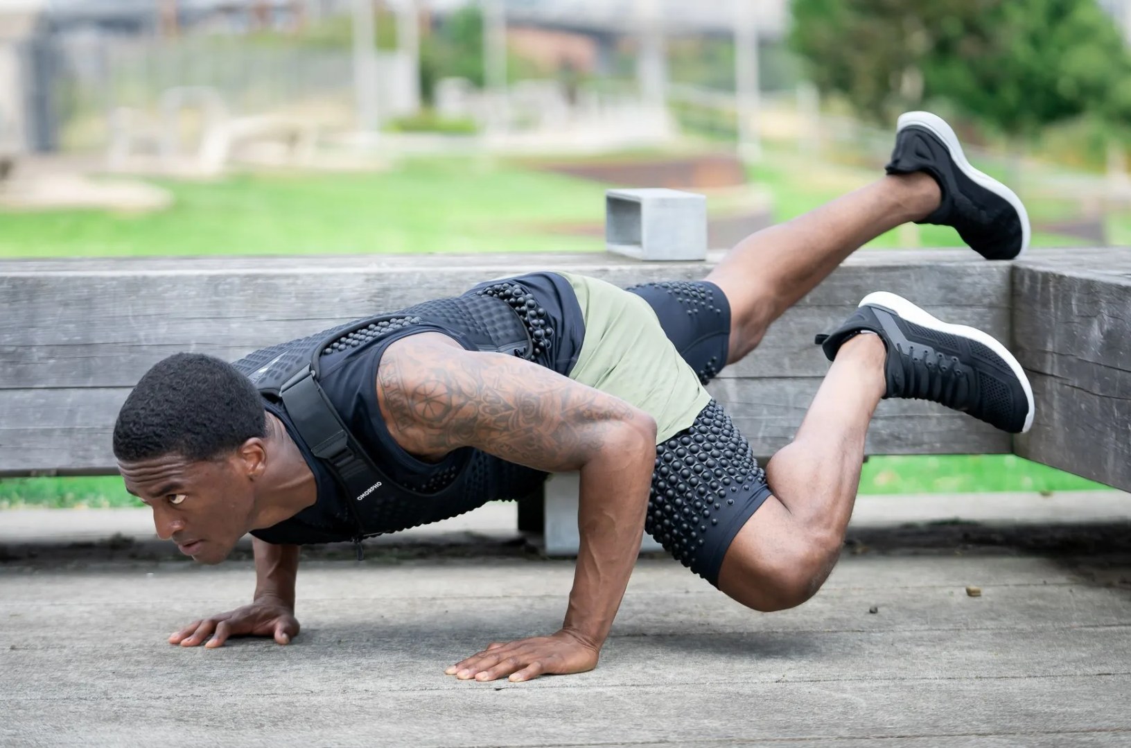 man exercising while wearing omorpho g vest